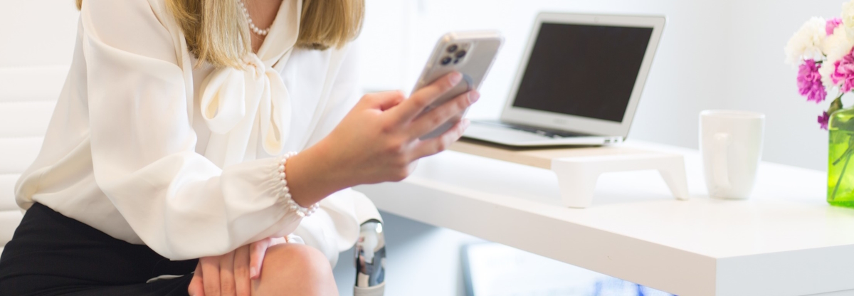 Woman holding a mobile device